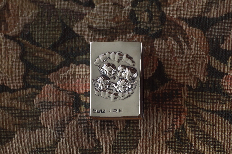エンジェルズヘッズのシルバーマッチカバー　ジョシュア・レイノルズ　イギリス　アンティークストリュフ
